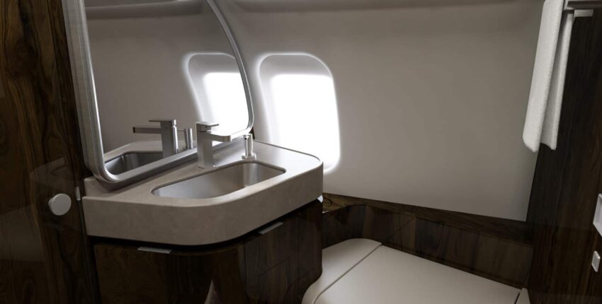 Salle de bain luxueuse Challenger 650 avec bois et éclairage.